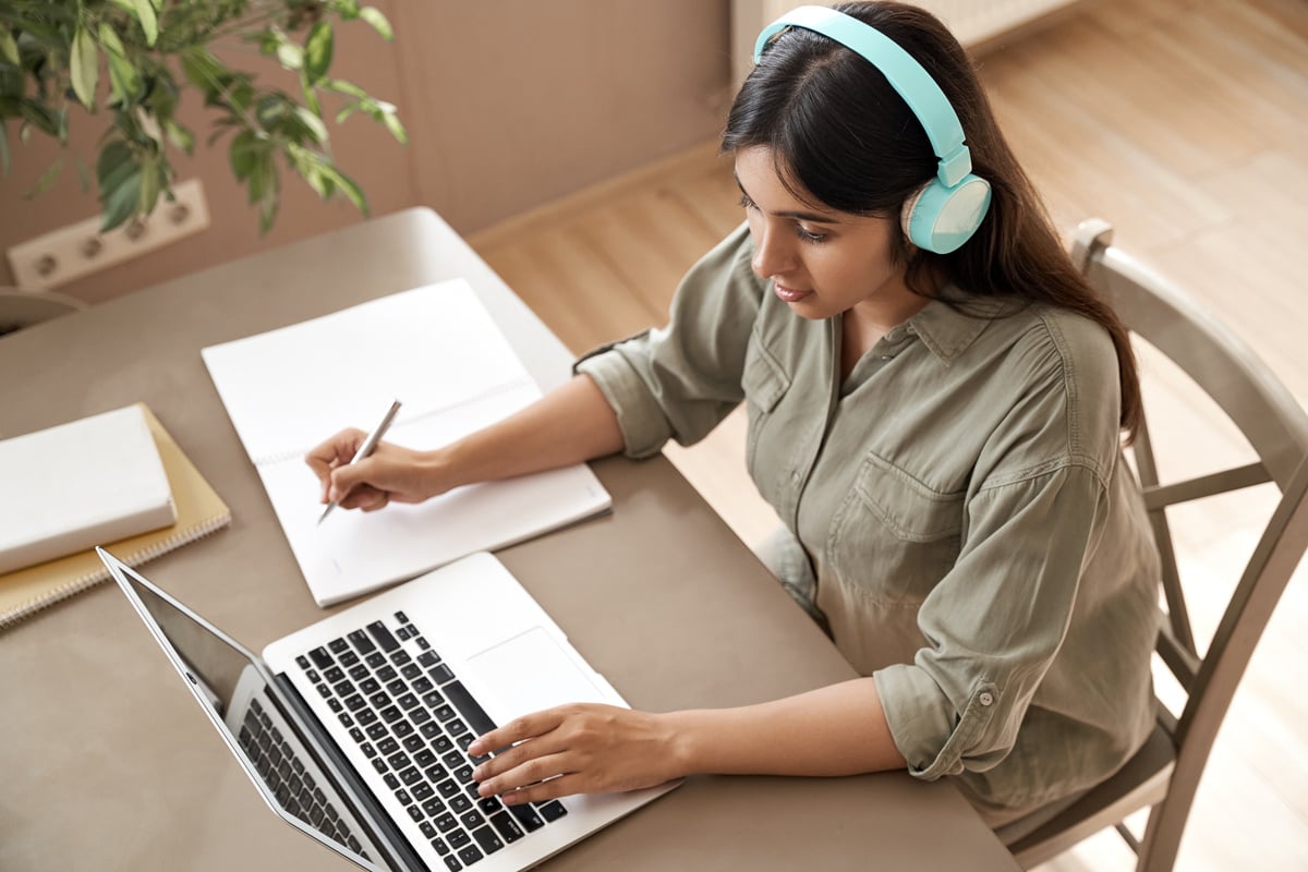 Girl Attending Online Classes at Home with Laptop